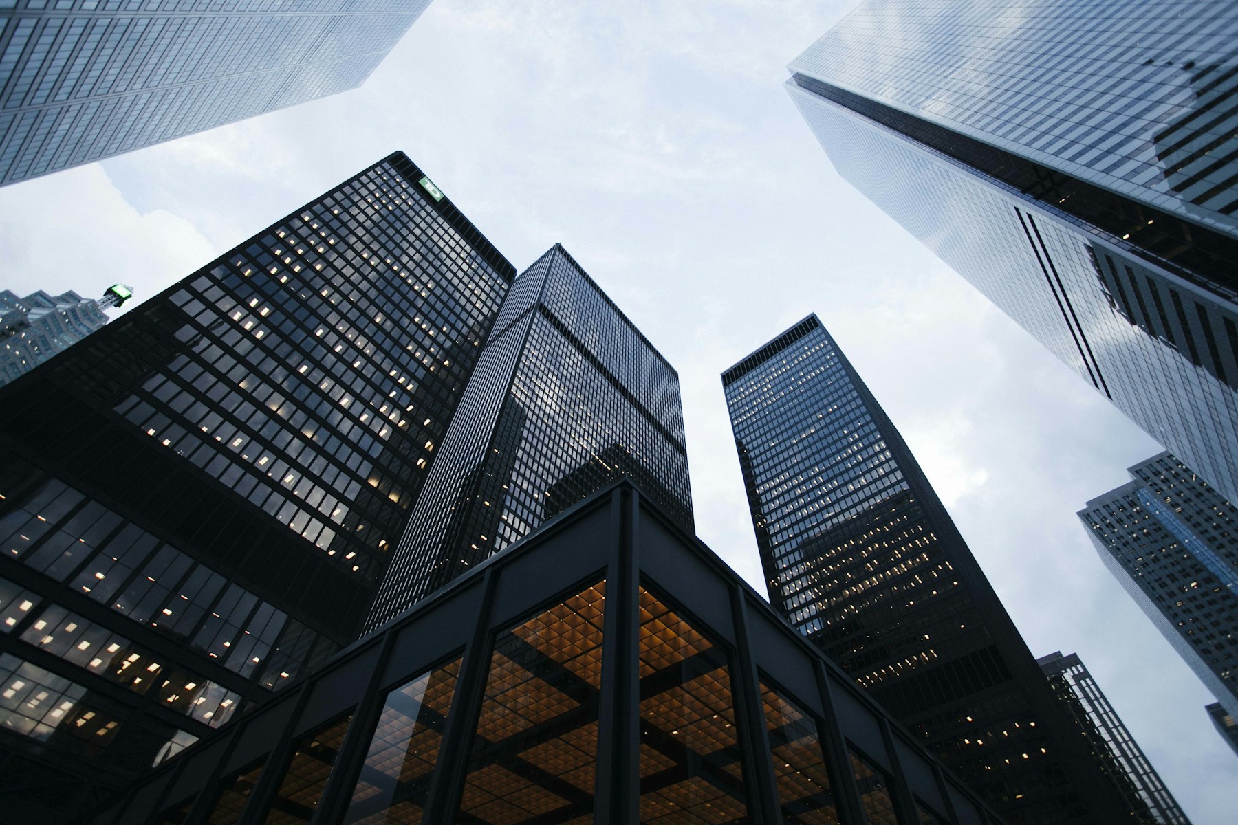 Looking upward through the clean lines and repeating windows of contemporary architecture